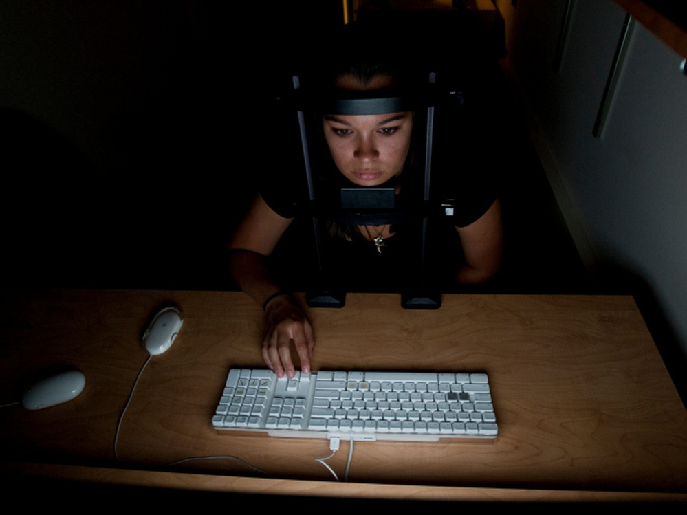 Test subjects in cognitive scientist Daphne Bavelier's study try to determine what direction erratically moving dots on a computer screen are going. 