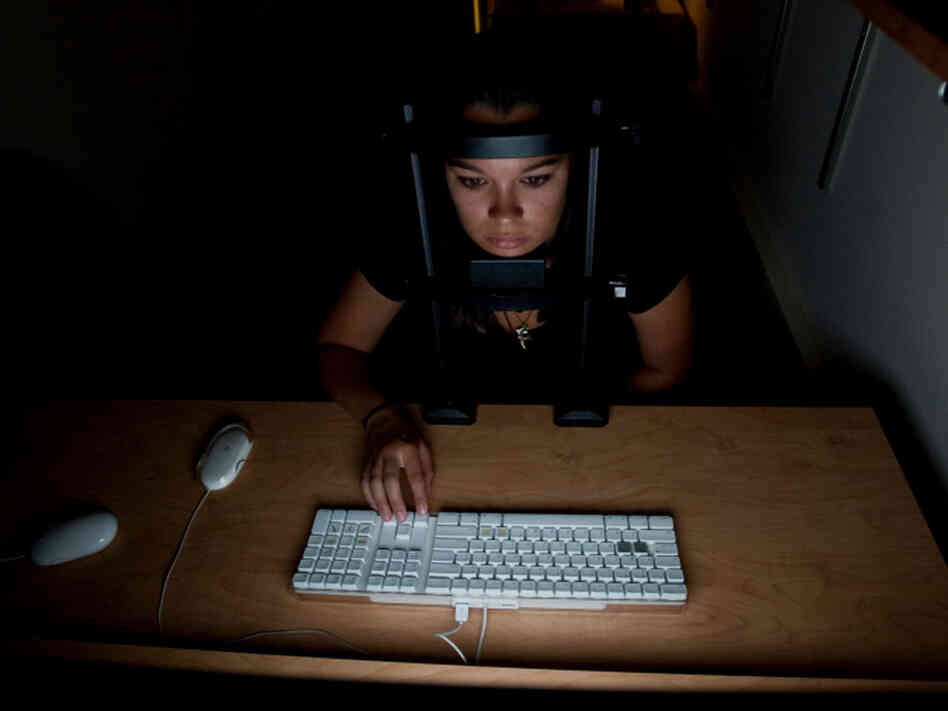 Test subjects in cognitive scientist Daphne Bavelier's study try to determine what direction erratically moving dots on a computer screen are going. 
