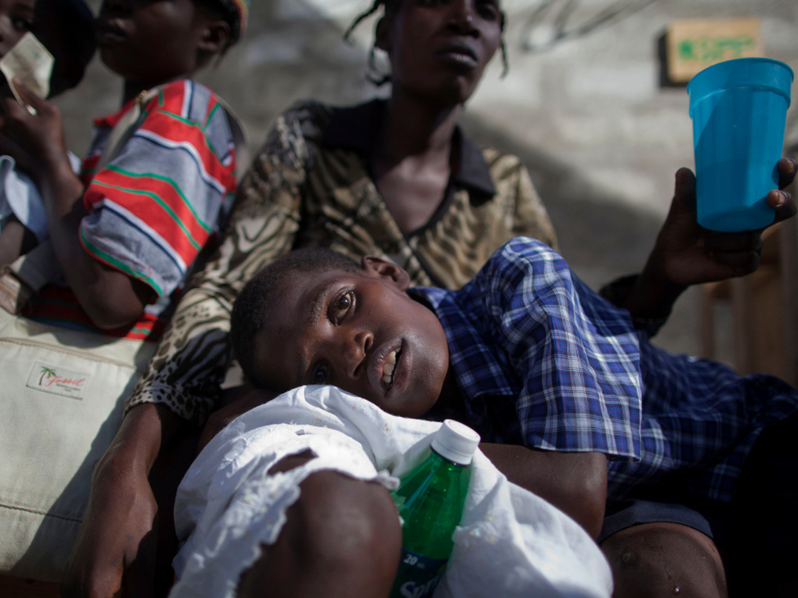 A boy with symptoms of cholera waits for treatment at the St. Catherine hospital in Cite Soleil in Port-au-Prince on Nov. 10, 2010. Cholera has sickened more than 91,000 Haitians and killed more than 2,000.