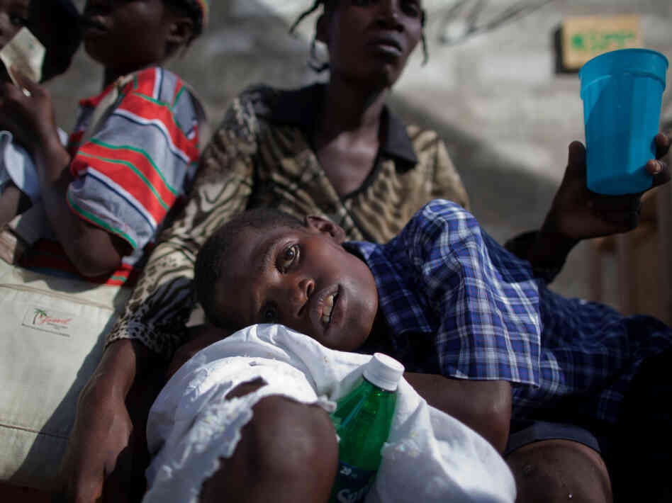 A boy with symptoms of cholera waits for treatment at the St. Catherine hospital in Cite Soleil in Port-au-Prince on Nov. 10, 2010. Cholera has sickened more than 91,000 Haitians and killed more than 2,000.