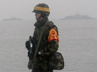 A South Korean marine stands guard on Yeonpyeong island on Friday. A South Korean marine stands guard on Yeonpyeong island on Friday.
