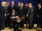 President Barack Obama signs the extension of the Bush-era tax cuts and jobless benefits. President Barack Obama signs the extension of the Bush-era tax cuts and jobless benefits.