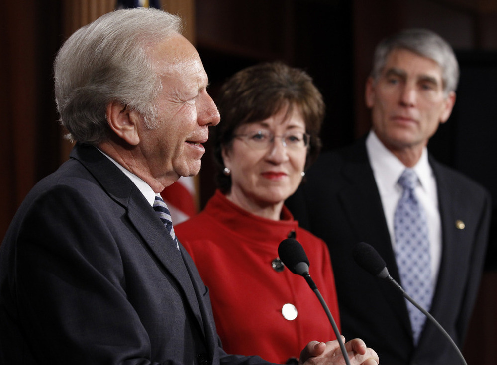 Sen. Joseph Lieberman (I-CT) left, with Sen. Susan Collins (R-ME) and Sen. Mark Udall (D-CO), talks about the passage of a bill to repeal "don't ask, don't tell" at the Capitol on Saturday. 