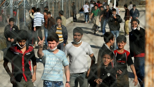 Immigrants wait at a detention center in the village of Fylakio near the the Greek-Turkish border. Immigrants wait at a detention center in the village of Fylakio near the the Greek-Turkish border.