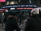 News of "don't ask, don't tell" on a news-crawl sign in Times Square, New York City. News of "don't ask, don't tell" on a news-crawl sign in Times Square, New York City.
