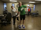 Brendan Jannesen, 23, plays Wii ping pong has part of his balancing therapy with physical therapist Brian Smith. Brendan Jannesen, 23, plays Wii ping pong has part of his balancing therapy with physical therapist Brian Smith.