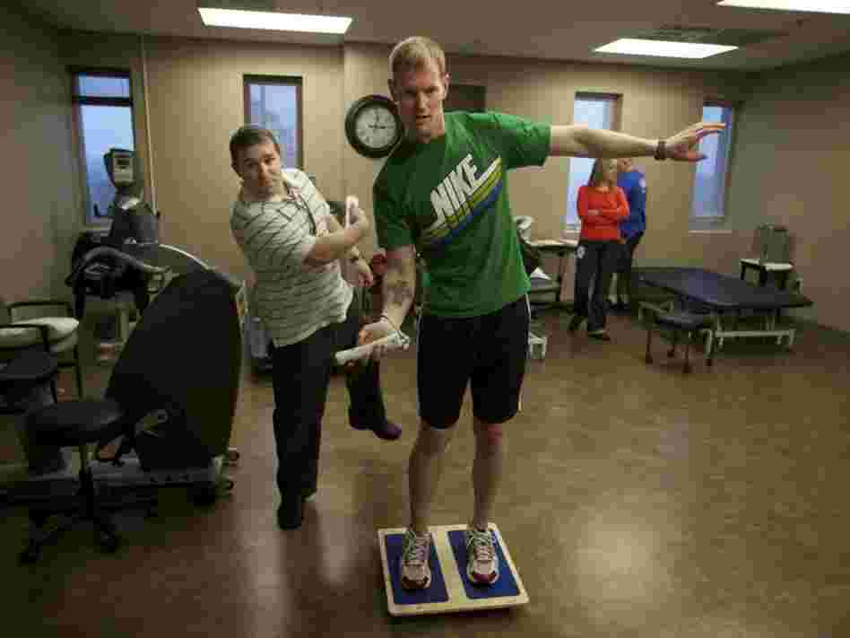 Brendan Jannesen, 23, plays Wii ping pong has part of his balancing therapy with physical therapist Brian Smith. Brendan Jannesen, 23, plays Wii ping pong has part of his balancing therapy with physical therapist Brian Smith.