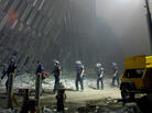 Firefighters make their way through the rubble of the World Trade Center in New York on Sept. 11, 2001. Firefighters make their way through the rubble of the World Trade Center in New York on Sept. 11, 2001.