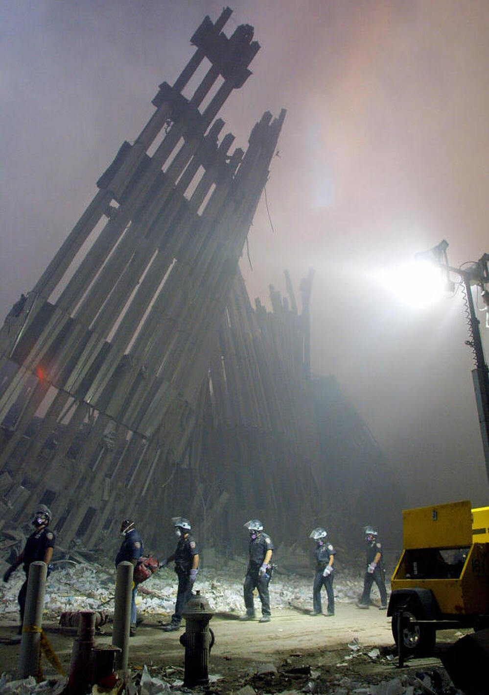 Firefighters make their way through the rubble of the World Trade Center in New York on Sept. 11, 2001.