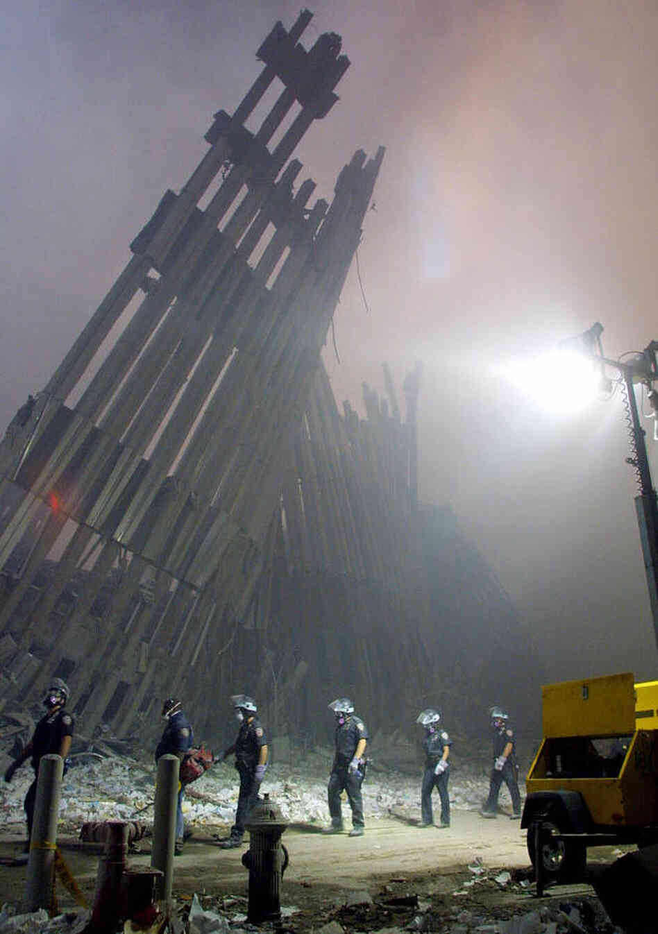Firefighters make their way through the rubble of the World Trade Center in New York on Sept. 11, 2001.