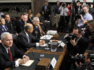 Defense Secretary Robert Gates is the subject of news photographers at a Senate Armed Services Committee hearing, Dec. 2, 2010. Defense Secretary Robert Gates is the subject of news photographers at a Senate Armed Services Committee hearing, Dec. 2, 2010.