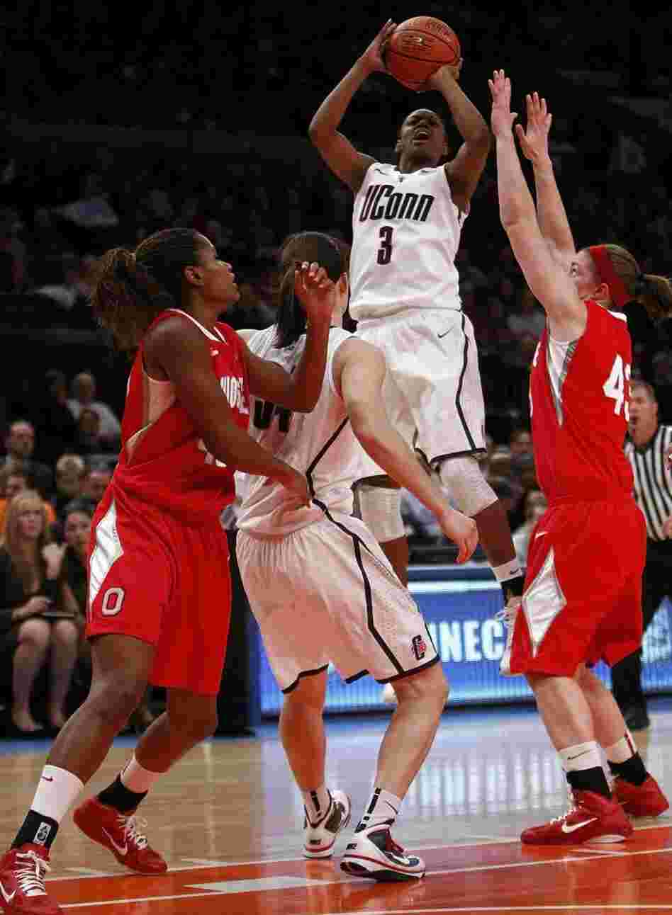 Tiffany Hayes (#3) of the Connecticut Huskies takes a jump shot against the Ohio State Buckeyes at Madison Square Garden on Dec. 19, 2010.