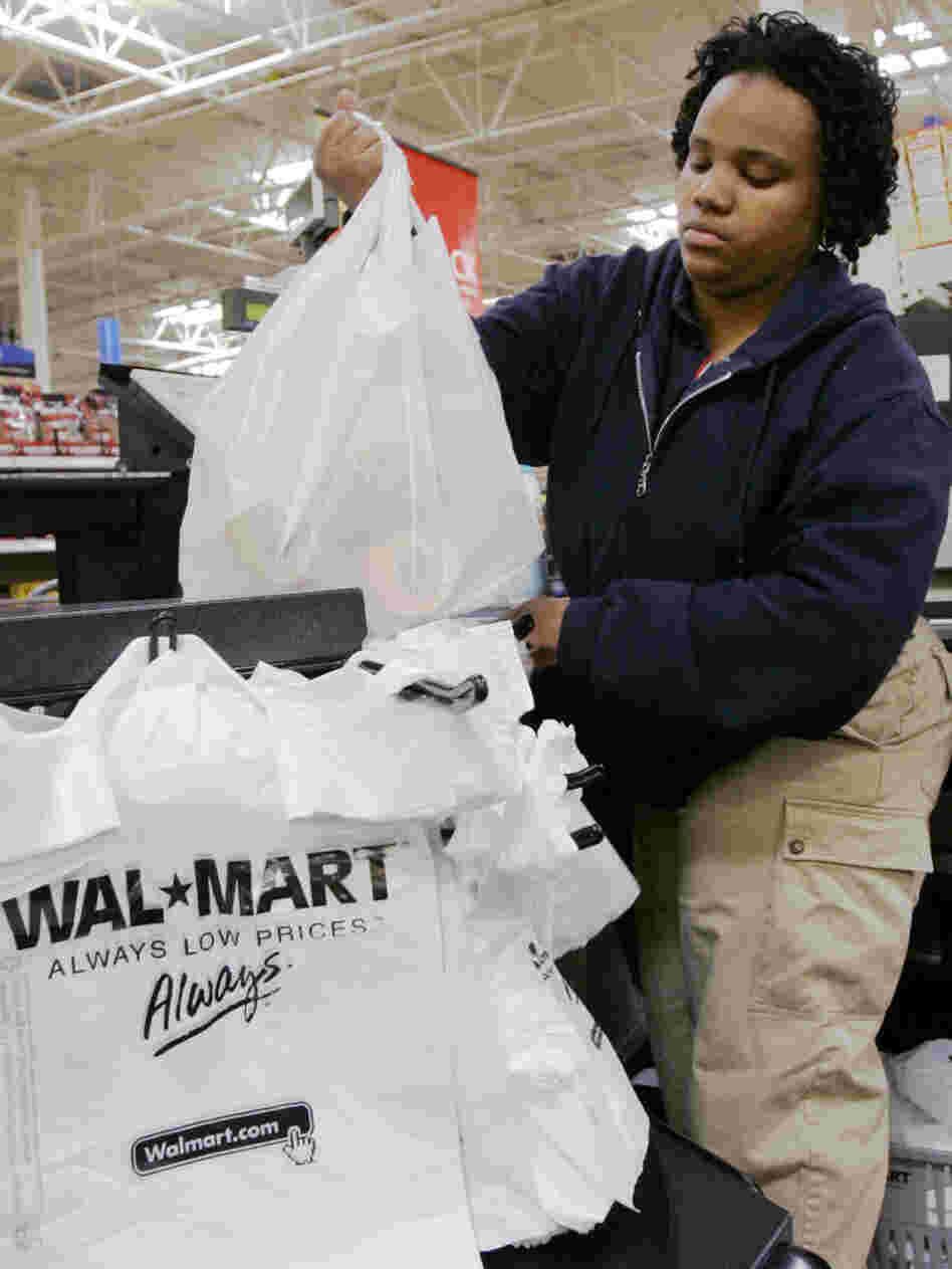 Cashier Shawntee Powell bags merchandise at Chicago's Walmart in 2007. Other big-box stores, including Target, also have big-city plans. Cashier Shawntee Powell bags merchandise at Chicago's Walmart in 2007. Other big-box stores, including Target, also have big-city plans.