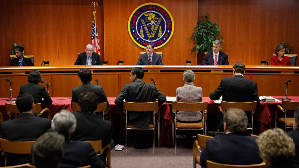 Federal Communications Commission commissioners listen to staff recommendations.