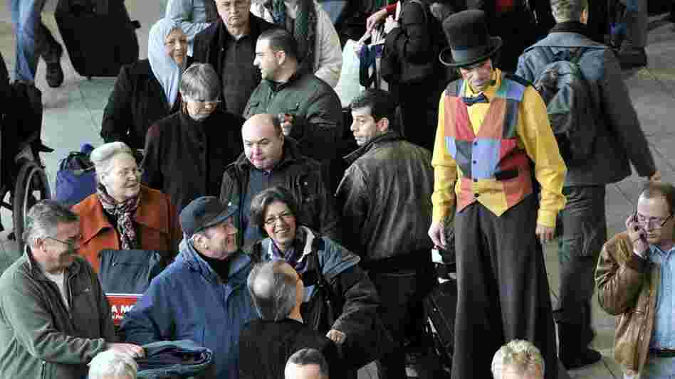 A clown entertains stranded travelers at the Frankfurt airport on December 19, 2010. 