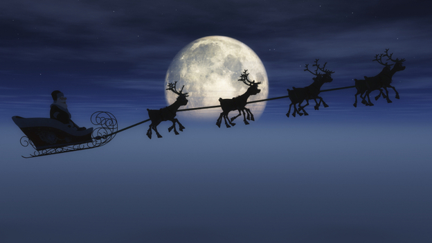 Santa's sleigh in front of the moon