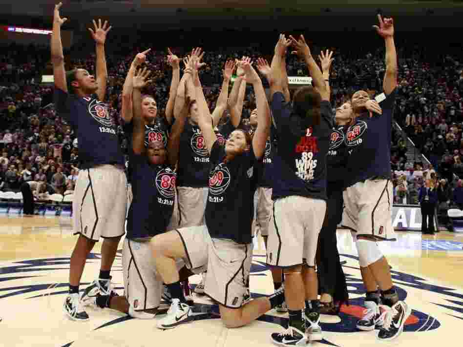 The Connecticut women's basketball team celebrates after their record-setting 89th straight win.