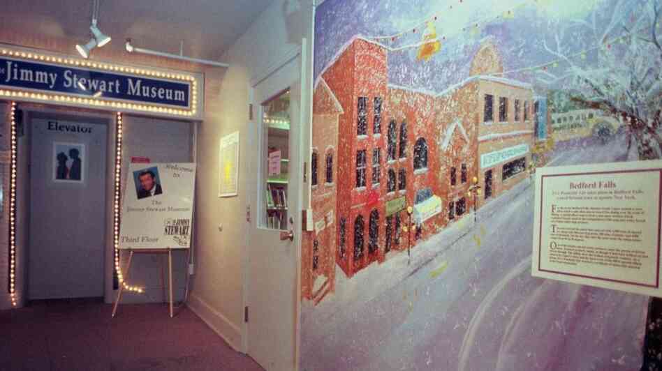 Lights circle the elevator entrance to the Jimmy Stewart Museum in Indiana, Pa., in 1999. The hall is decorated with movie posters, notes from movie studio executives, and this large mural depicting Bedford Falls, the mythical town in the film It's A Wonderful Life.