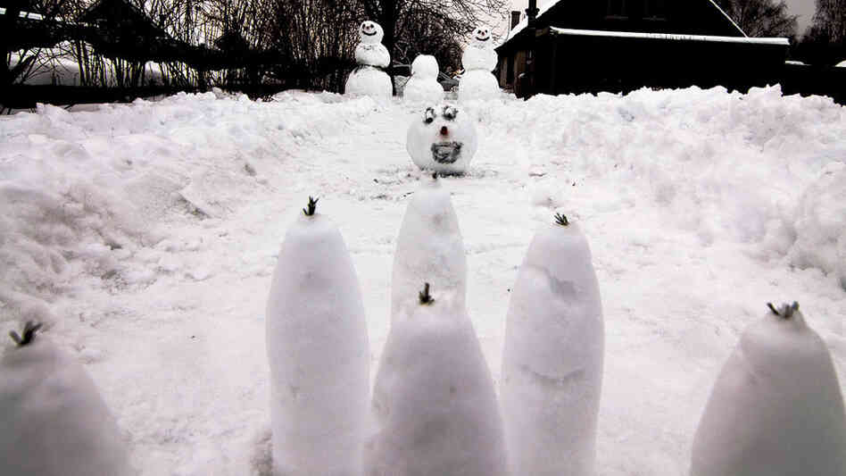 Snowmen bowl with their buddy's head — another Calvin and Hobbes strip come to life. 