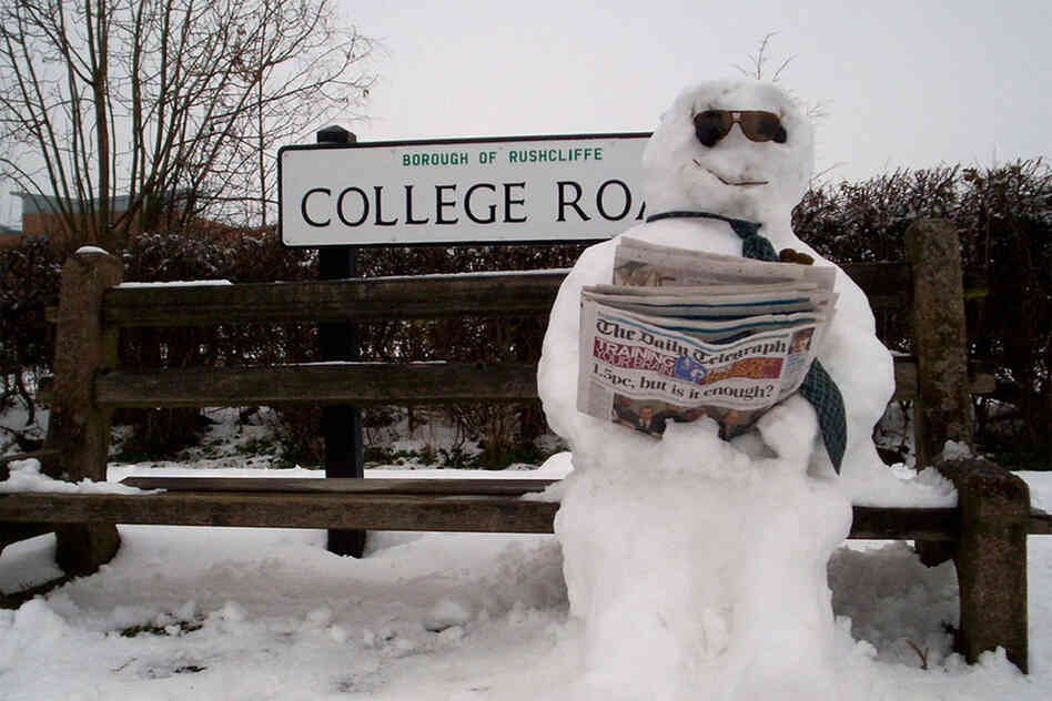 Snowmen have to wait for the bus just like the rest of us. 