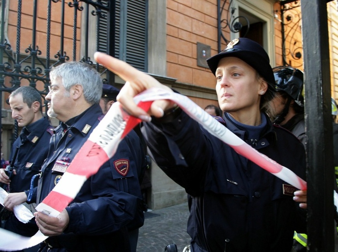 Police cordon off the Chilean Embassy in Rome, where a parcel bomb exploded today. A similar package exploded at the Swiss embassy.