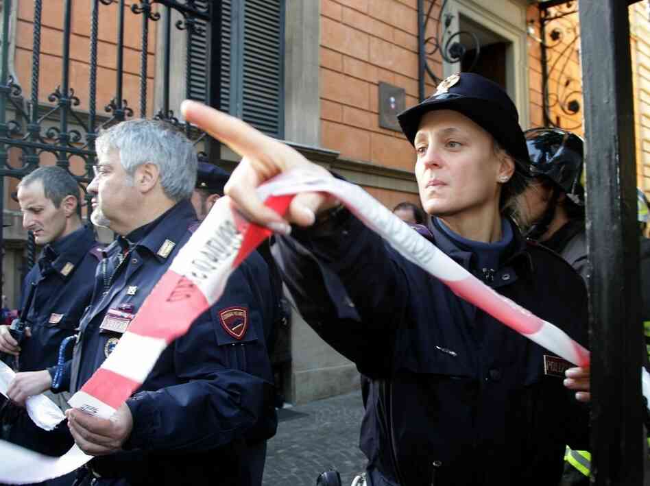 Police cordon off the Chilean Embassy in Rome, where a parcel bomb exploded today. A similar package exploded at the Swiss embassy.