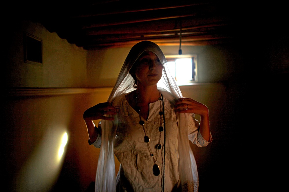 Shoshana Coburn, managing director of Turquoise Mountain, walks through buildings in Murad Khane that will eventually be used for offices, meeting rooms and classrooms.