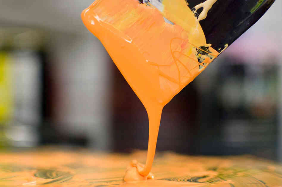 Mixing orange ink.