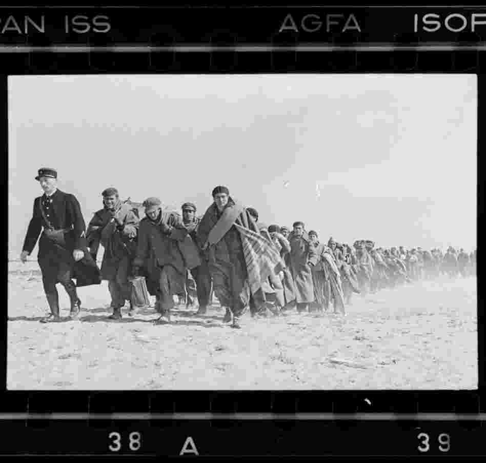 Exiled Republicans being marched down the beach to an internment camp, Le Barcares, France, March 1939 