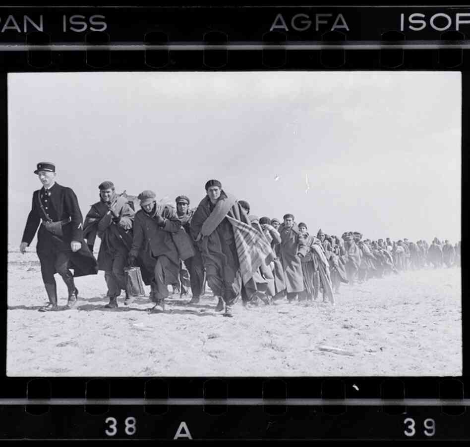Exiled Republicans being marched down the beach to an internment camp, Le Barcares, France, March 1939 