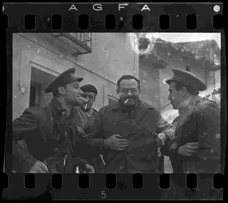 Ernest Hemingway (third from the left), New York Times journalist Herbert Matthews (second from the left) and two Republican soldiers, Teruel, Spain, late Dec. 1937 