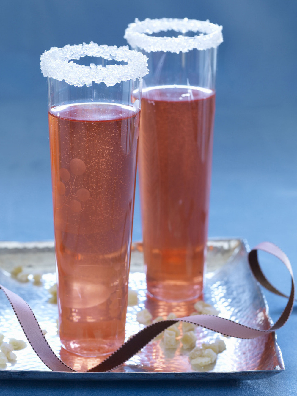 A Sparkling Ginger Daisy cocktail, in a sugar-rimmed glass