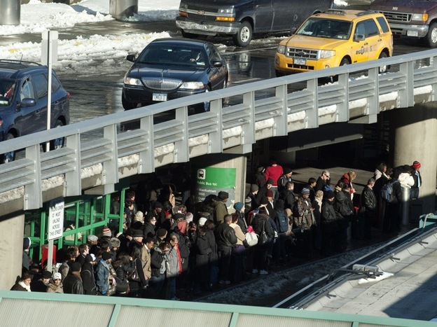 Travelers wait for taxis from New York's LaGuardia Airport on December 28, 2010.