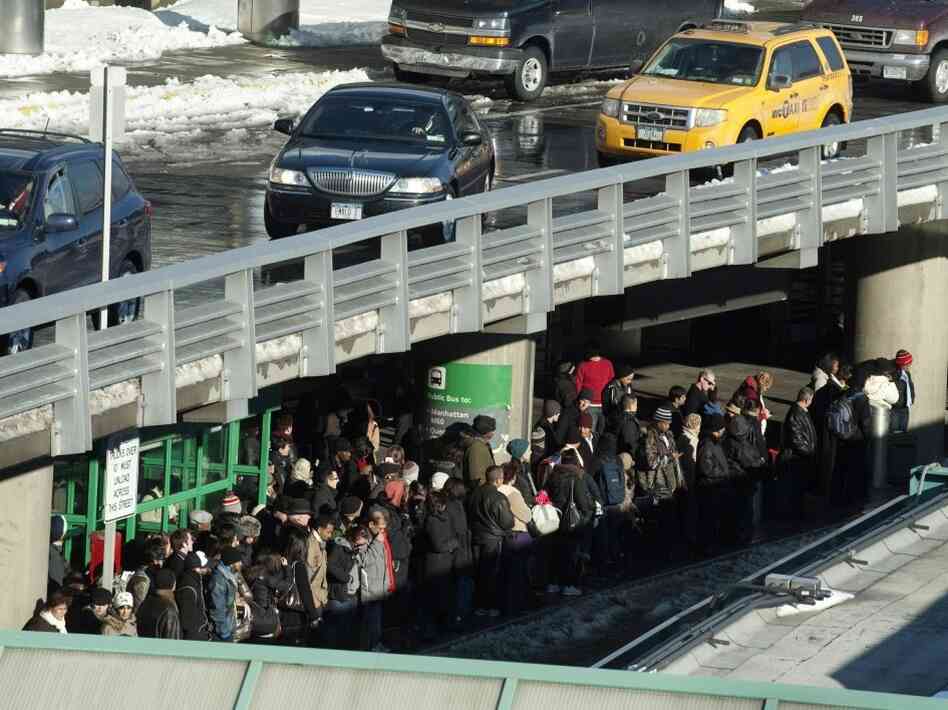 Travelers wait for taxis from New York's LaGuardia Airport on December 28, 2010.