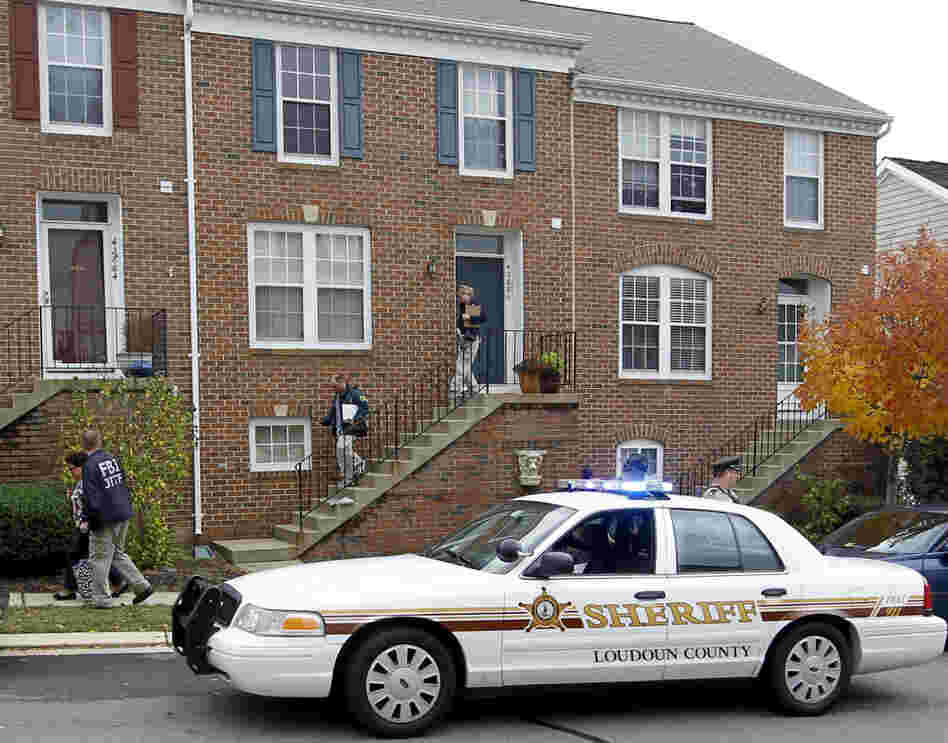 FBI and law enforcement investigators leave the home of Farooque Ahmed in Ashburn,  Va., on Oct. 27. Ahmed was charged with trying to help people he believed were al-Qaida operatives plan to bomb subway stations around Washington,  D.C.