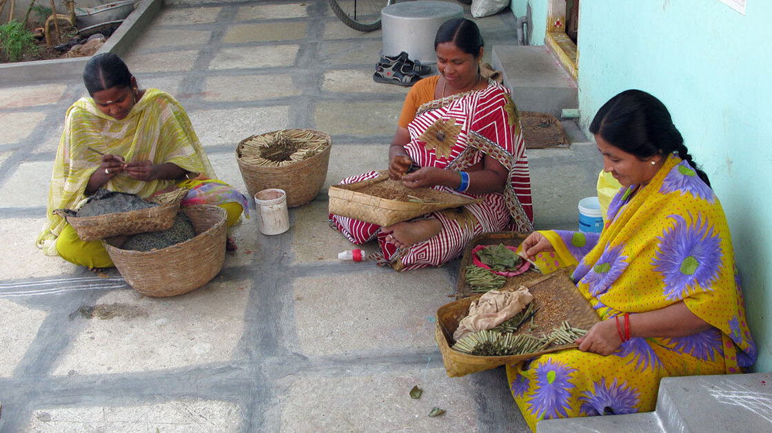 Rama (right) rolls small cigars called bidis, for a living, making between 30  and 40 rupees a day, less than a dollar.  She says she owes more than $1,200 in  loans to five microfinance companies -- money she can never hope to repay.