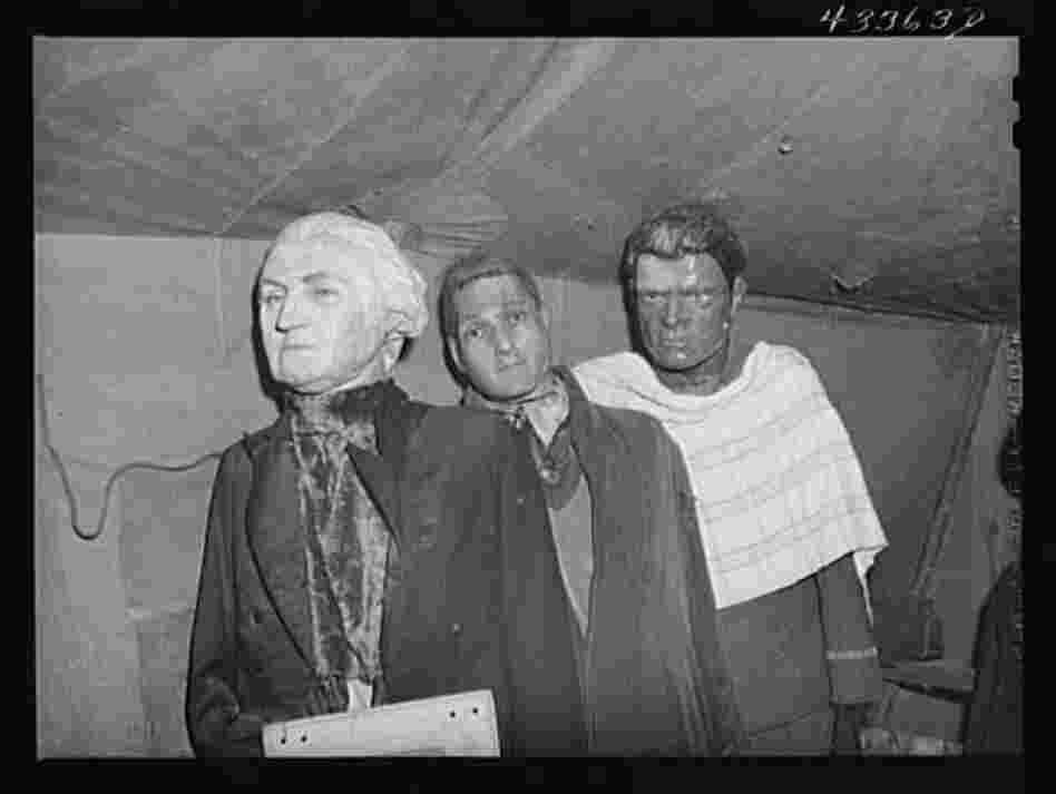 Effigies of Washington, Joe Louis and another criminal