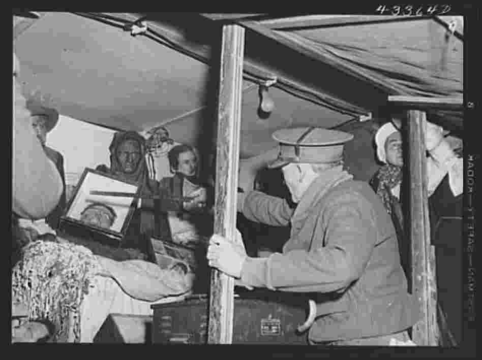 Inside the traveling sideshow, Thornton points out the exhibits.