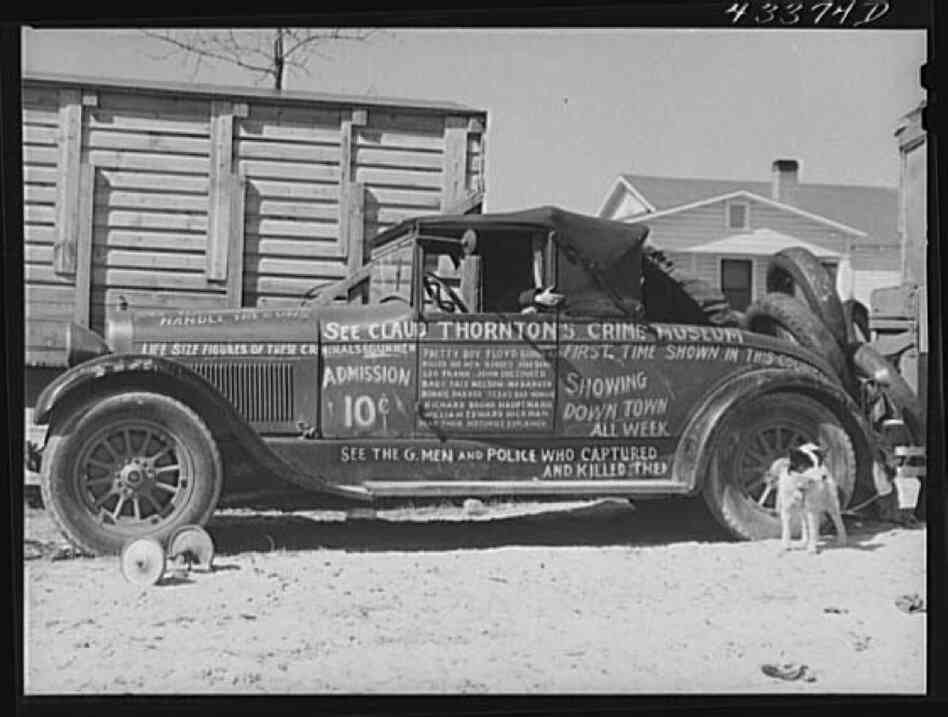 A car advertises the travelling sideshow.