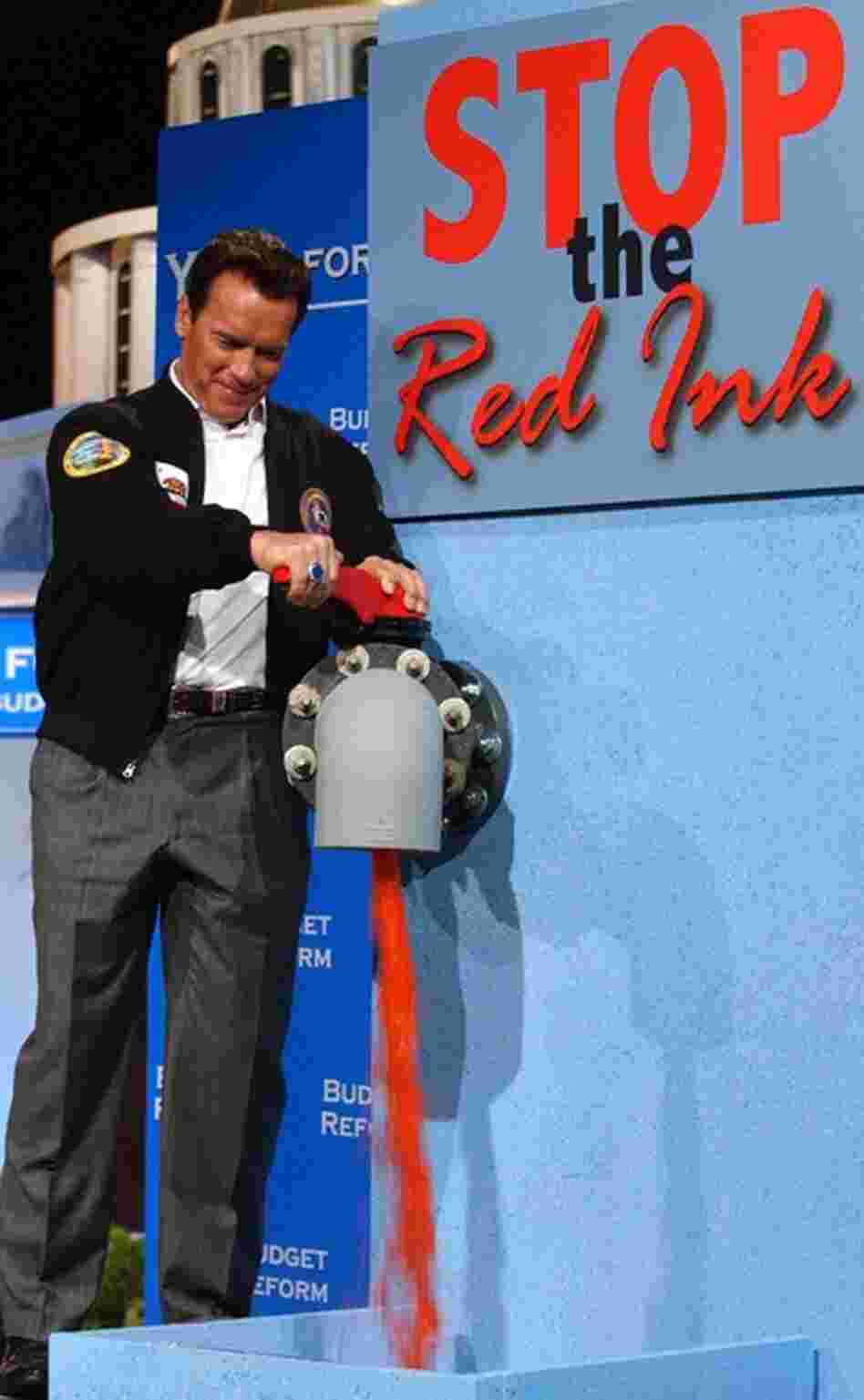 Schwarzenegger stops the flow of fake red ink during a news conference to discuss cutting state spending in Sacramento. "The Governator" had pledged to fix the state's financial mess, but he leaves behind a $28 billion budget shortfall. 