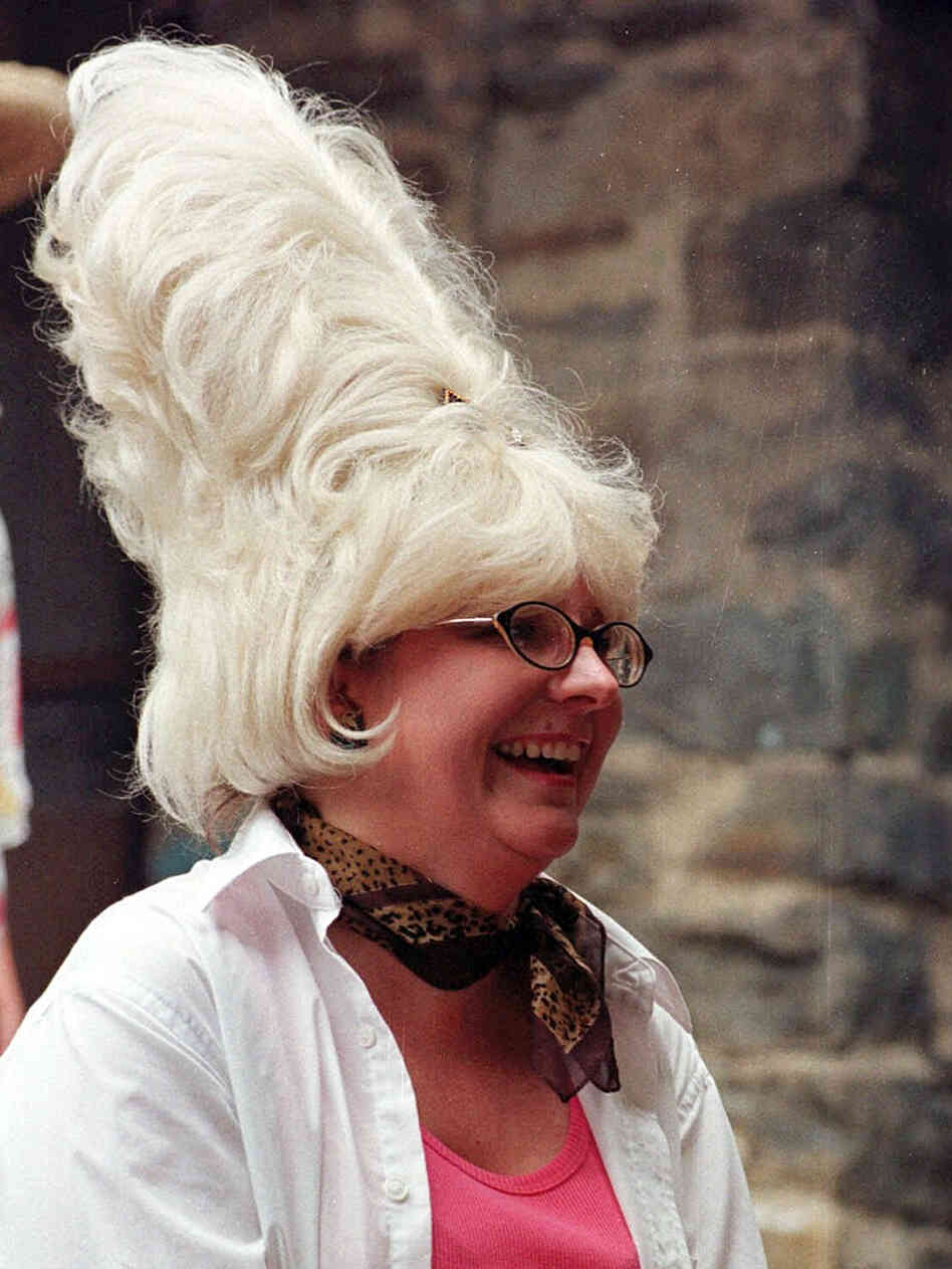 Owner of Cafe Hon and HonFest founder Denise Whiting applauds as contestants participate in the 1999 HonFest. The annual, daylong festival began in 1994. Owner of Cafe Hon and HonFest founder Denise Whiting applauds as contestants participate in the 1999 HonFest. The annual, daylong festival began in 1994.