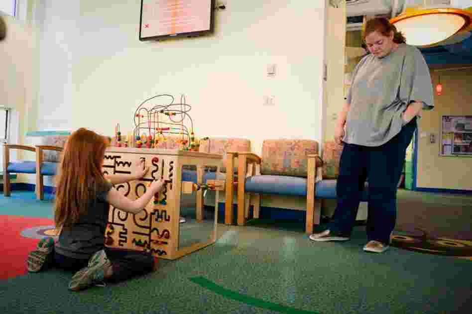 Katie and her mother, Sherri Oliver, travel two hours by bus from the Eastern Shore of Maryland every month to come to the lead clinic at the Mt. Washington Pediatric Hospital.