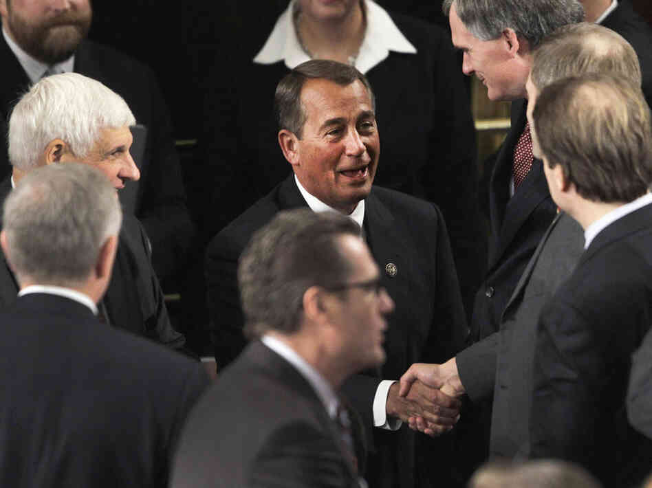 House Speaker John Boehner of Ohio greets House members during the first session of the 112th Congress on Wednesday.