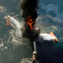 The Deepwater Horizon oil rig burns in the Gulf of Mexico last April. An excerpt of a presidential commission's probe  into the rig explosion released on Thursday says risky decisions caused the disaster.