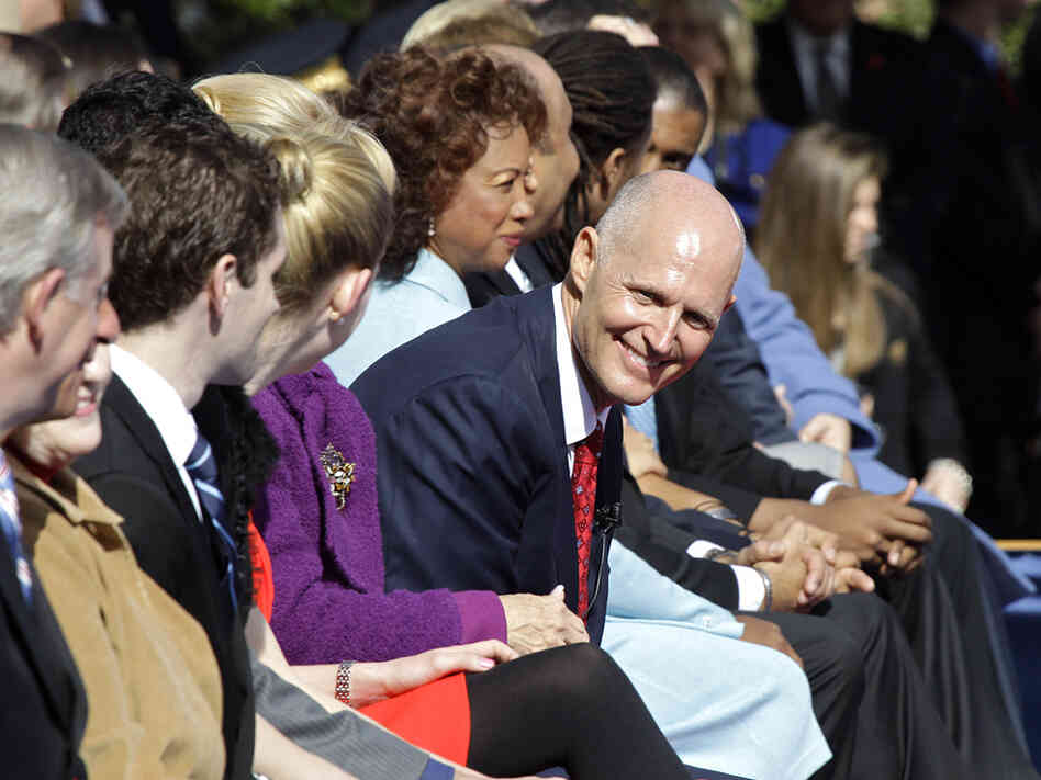 Florida Gov. Rick Scott smiles during inauguration ceremonies in Tallahassee Tuesday. Scott defeated incumbent Charlie Crist, who had been elected as a Republican.