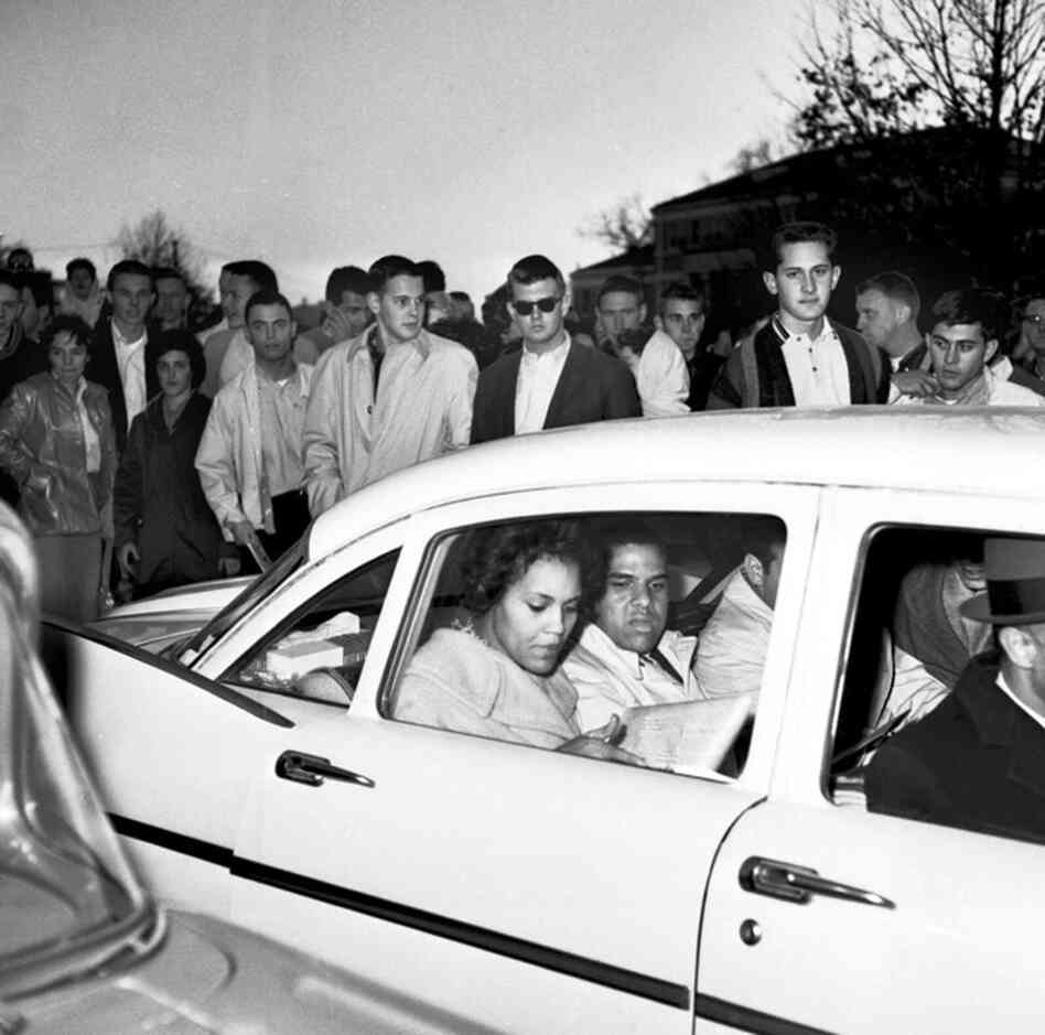 I remember being more concerned with finding a pen in my very large purse than being worried about the ugly jeers outside our window. Oddly enough, neither of us believed we were in danger — despite the racist taunts of "Kill the niggers." 