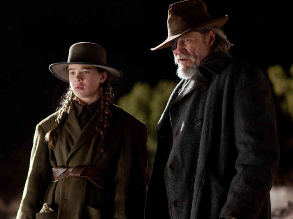 Mattie Ross (Hailee Steinfeld) and U.S. Marshal Reuben "Rooster" Cogburn (Jeff Bridges) seek the man who gunned down her father in Joel and Ethan Coen's True Grit