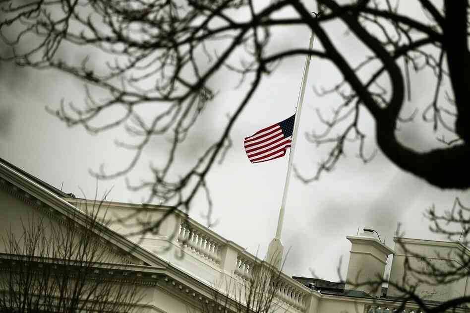 The flag on op top of the White House flies at half-staff Monday in honor of those killed and wounded in Tucson. 