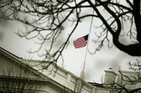 The flag on op top of the White House flies at half-staff Monday in honor of those killed and wounded in Tucson.