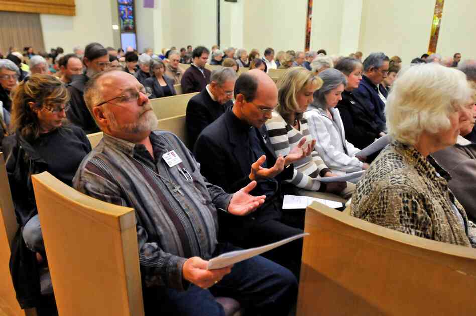 Parishioners attend an interfaith service at the Catalina United Methodist Church on Tuesday in Tucson. 